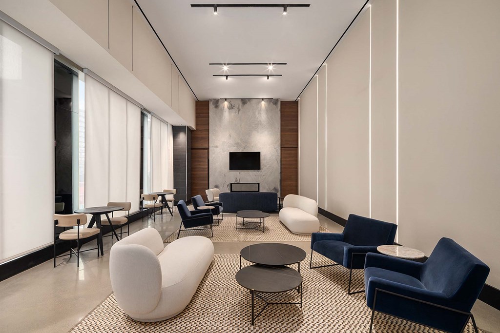 a lobby with couches and chairs and tables at The Paxton, Brooklyn, NY 11201